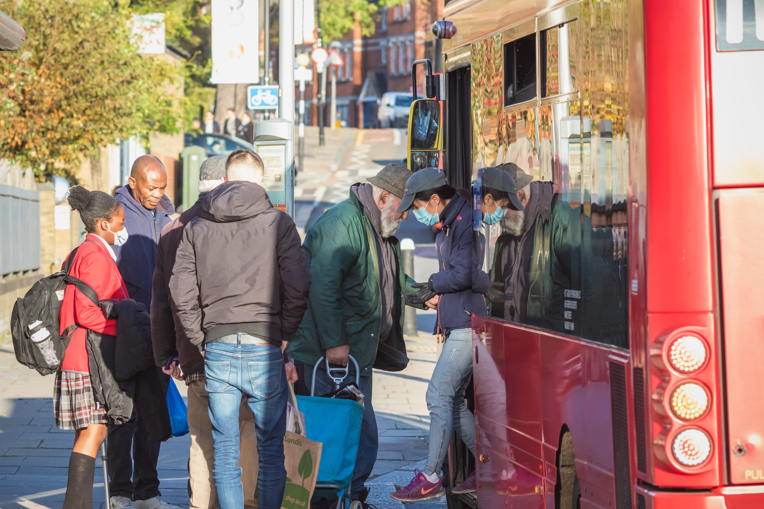 people getting on London bus